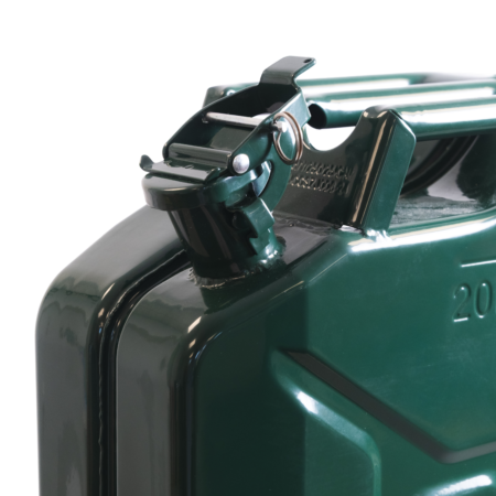 Close-up of a green metal stapler mechanism with a curved lever and metal pin.