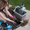 Fence planter with colourful flowers in bloom